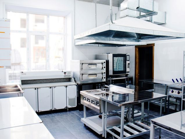 interior kitchen in a cafe or restaurant, professional kitchen equipment and appliances in the kitchen in a cafe,  extractor hood